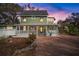 Charming two-story home with a welcoming front porch and landscaped yard at 6835 S Shamrock St, Tampa, FL 33616