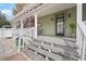 Inviting front porch with decorative columns and classic front door at 6835 S Shamrock St, Tampa, FL 33616
