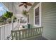Relaxing porch with porch swing, providing a comfortable outdoor seating area at 6835 S Shamrock St, Tampa, FL 33616