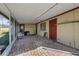 Enclosed patio featuring brick flooring, and a closed shed at 8343 Galewood Cir, Tampa, FL 33615