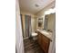 Bathroom with tub and shower, wood-look tile flooring and a granite-topped vanity at 913 Burlwood St, Brandon, FL 33511