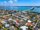 Aerial view showcasing a neighborhood near the beach, pinned with a marker on a single Gathering home at 920 Spruce Dr, Belleair Beach, FL 33786