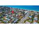 Scenic aerial shot of a residential neighborhood near the beach, highlighted with a pinpoint marker at 920 Spruce Dr, Belleair Beach, FL 33786