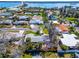 Aerial view of a serene neighborhood, showcasing proximity to the waterway and a quaint residential street at 920 Spruce Dr, Belleair Beach, FL 33786