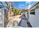 Backyard featuring a spacious deck, a storage shed, lush greenery, and a paved patio at 920 Spruce Dr, Belleair Beach, FL 33786