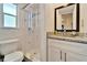 Clean bathroom featuring a toilet, vanity with granite countertop, and walk-in shower at 920 Spruce Dr, Belleair Beach, FL 33786