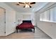 Bright bedroom with large windows, new floors, and a ceiling fan at 920 Spruce Dr, Belleair Beach, FL 33786