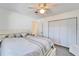 Bright bedroom with large windows, new floors, and a ceiling fan at 920 Spruce Dr, Belleair Beach, FL 33786