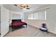 Bright bedroom with large windows, new floors, and a ceiling fan at 920 Spruce Dr, Belleair Beach, FL 33786