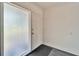 Bright entryway featuring new flooring, a white door and a gray rug at 920 Spruce Dr, Belleair Beach, FL 33786