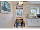 Kitchen with white cabinets, a cozy breakfast nook, and a picturesque window at 920 Spruce Dr, Belleair Beach, FL 33786