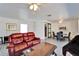 Inviting living area flows into dining space, featuring a barn door and comfortable leather seating at 920 Spruce Dr, Belleair Beach, FL 33786