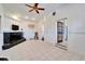 Open living room with tile flooring, fireplace and convenient access to other rooms at 920 Spruce Dr, Belleair Beach, FL 33786