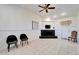 Bright living room with tiled floors, fireplace, neutral walls, and ceiling fan at 920 Spruce Dr, Belleair Beach, FL 33786