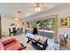 Spacious open-concept living room, seamlessly blending living and dining areas, and with access to the backyard at 920 Spruce Dr, Belleair Beach, FL 33786