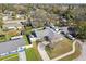 Aerial view of the home showing a long driveway, the yard, and the patio at 1015 Coldstream Ct, Tarpon Springs, FL 34689
