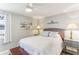 Cozy bedroom featuring a queen-sized bed, ceiling fan, and window, offering a peaceful retreat at 1015 Coldstream Ct, Tarpon Springs, FL 34689