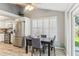 The open floor plan features a dining area near an updated kitchen and backyard access at 1015 Coldstream Ct, Tarpon Springs, FL 34689