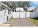 Gated driveway, leading to a large RV parking area behind a privacy fence at 1015 Coldstream Ct, Tarpon Springs, FL 34689