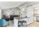 Bright kitchen featuring an island with seating, modern appliances, and stylish backsplash detail at 1015 Coldstream Ct, Tarpon Springs, FL 34689