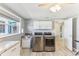 Laundry room with washer, dryer, sink, counter space, and tile flooring at 1015 Coldstream Ct, Tarpon Springs, FL 34689