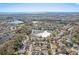 Community aerial view showcasing the home near lakes and lush landscaping at 12030 Steppingstone Blvd, Tampa, FL 33635