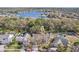 Aerial view of the property showcasing its location near a lake, community, and surrounding landscape at 12030 Steppingstone Blvd, Tampa, FL 33635