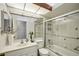 Bathroom featuring shower-tub combo, and updated vanity with large mirror at 12030 Steppingstone Blvd, Tampa, FL 33635