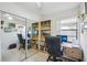 Bedroom features a sliding closet, desk, bookshelves and neutral colored walls at 12030 Steppingstone Blvd, Tampa, FL 33635