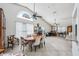 Open dining room with high ceilings, a decorative stained glass window, and a view into additional living spaces at 12030 Steppingstone Blvd, Tampa, FL 33635