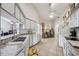 Bright kitchen with white cabinets, granite countertops, stainless steel appliances, and ample storage space at 12030 Steppingstone Blvd, Tampa, FL 33635