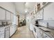 Spacious kitchen with white appliances, tile flooring, and plenty of cabinet space for storage and functionality at 12030 Steppingstone Blvd, Tampa, FL 33635
