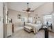 Bright main bedroom with vaulted ceiling, tile flooring, and a large window at 12030 Steppingstone Blvd, Tampa, FL 33635