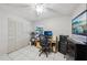 Bright office featuring a ceiling fan, a large closet and modern furnishings at 12030 Steppingstone Blvd, Tampa, FL 33635