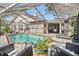 Screened in pool and patio area perfect for enjoying the outdoors at 12030 Steppingstone Blvd, Tampa, FL 33635