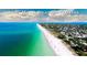 Aerial view of Anna Maria Island's shoreline with blue water and beach houses at 1320 Bottlebrush Dr, Bradenton, FL 34208