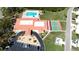 Aerial view of community clubhouse, pool, parking, and sport court at 1320 Bottlebrush Dr, Bradenton, FL 34208