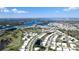 Breathtaking aerial shot captures a charming residential area, with scenic waterways and lush greenery in the background at 1320 Bottlebrush Dr, Bradenton, FL 34208