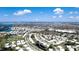 Picturesque aerial image shows a thriving neighborhood, complete with tree-lined streets and sparkling waterfront views at 1320 Bottlebrush Dr, Bradenton, FL 34208