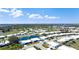 Scenic aerial view of a residential community with a pond, showcasing the property's tranquil setting at 1320 Bottlebrush Dr, Bradenton, FL 34208