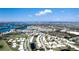 Expansive aerial view reveals a vibrant community, nestled among winding roads and picturesque bodies of water at 1320 Bottlebrush Dr, Bradenton, FL 34208