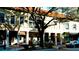 Charming storefronts with lush landscaping and architectural details create a welcoming ambiance for shoppers at 1320 Bottlebrush Dr, Bradenton, FL 34208