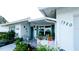 Front of home featuring the front door, manicured landscaping, and a sidewalk at 1320 Bottlebrush Dr, Bradenton, FL 34208