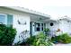 Home with beautiful landscaping, decorative details, and a welcoming front entrance at 1320 Bottlebrush Dr, Bradenton, FL 34208
