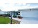 Charming home featuring a well-maintained lawn, a white exterior, and a convenient attached two-car garage at 1320 Bottlebrush Dr, Bradenton, FL 34208