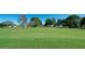 Beautiful golf course with lush green fairways and mature trees on a sunny day at 1320 Bottlebrush Dr, Bradenton, FL 34208