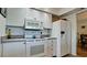 Efficient kitchen featuring essential appliances, ample counter space, and storage cabinets at 1320 Bottlebrush Dr, Bradenton, FL 34208