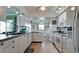 Functional kitchen with white cabinetry, granite countertops, and stainless steel appliances at 1320 Bottlebrush Dr, Bradenton, FL 34208