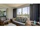 Relaxing lanai featuring wicker furniture, large windows offering picturesque outdoor views, and neutral tile floors at 1320 Bottlebrush Dr, Bradenton, FL 34208