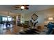 Living room with tile floors, neutral walls, ceiling fan, and modern furnishings at 1320 Bottlebrush Dr, Bradenton, FL 34208